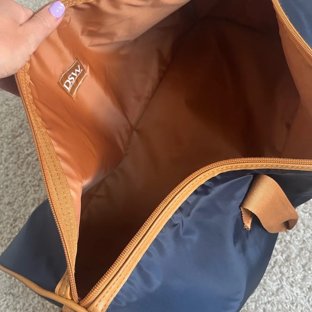 Stylish Navy and Tan carry on luggage with bottom storage